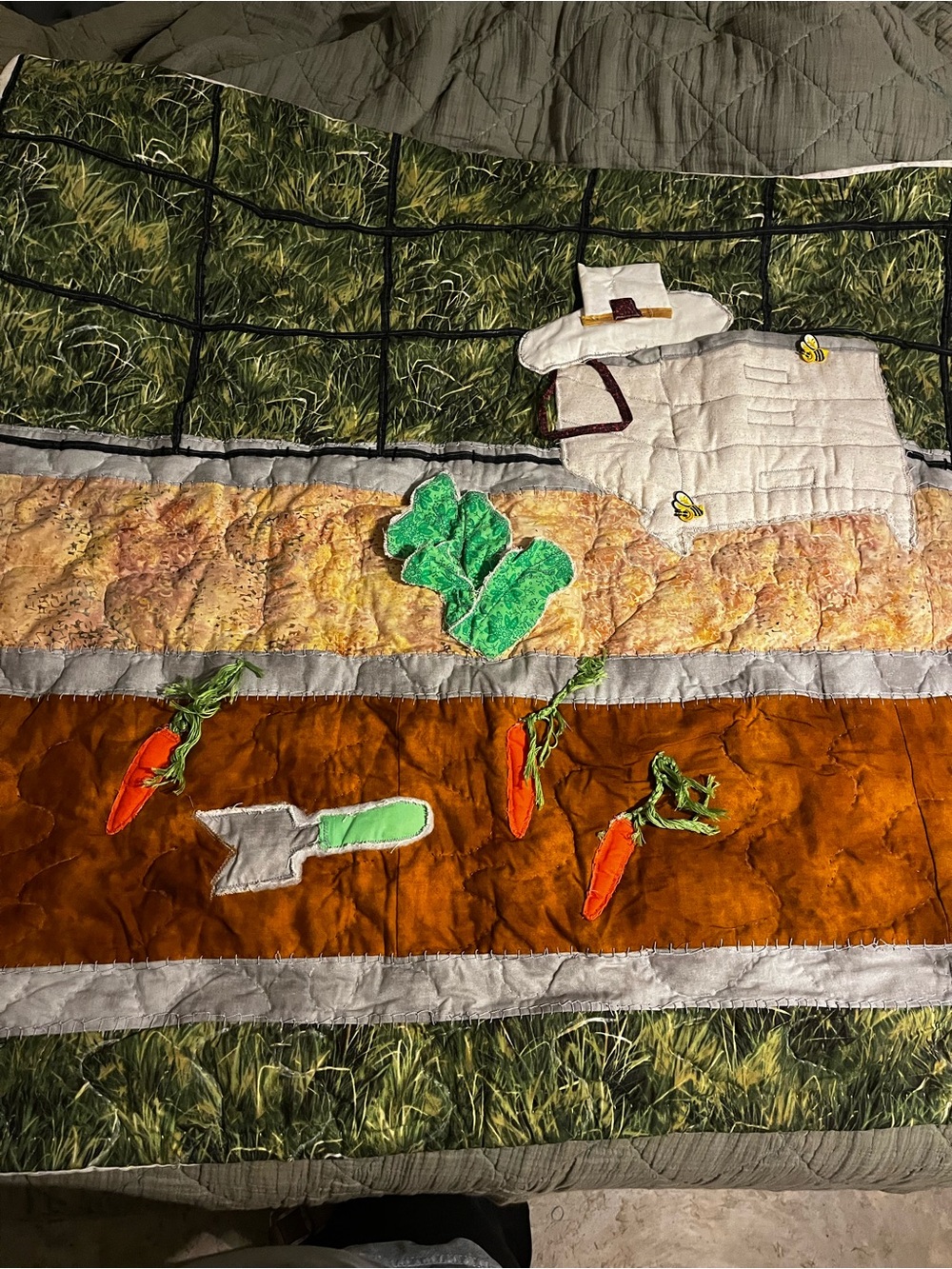 handmade fabric art quilt featuring a garden and farm theme with applique
